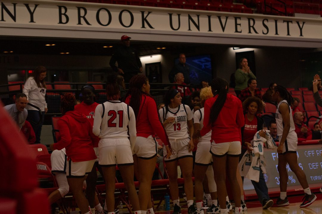 The Stony Brook womens basketball team gathers around the bench during a timeout in a game against Iona on Monday, Nov. 14. The Seawolves had an up and down first year in the CAA. ONESUN JEONG/THE STATESMAN