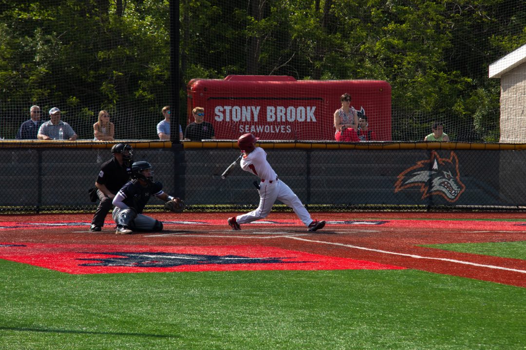 Second baseman Evan Fox takes a big swing in an at-bat against Monmouth on Friday, May 12. Fox broke the Stony Brook baseball teams stolen base record in its final series of the year. TIM GIORLANDO/THE STATESMAN