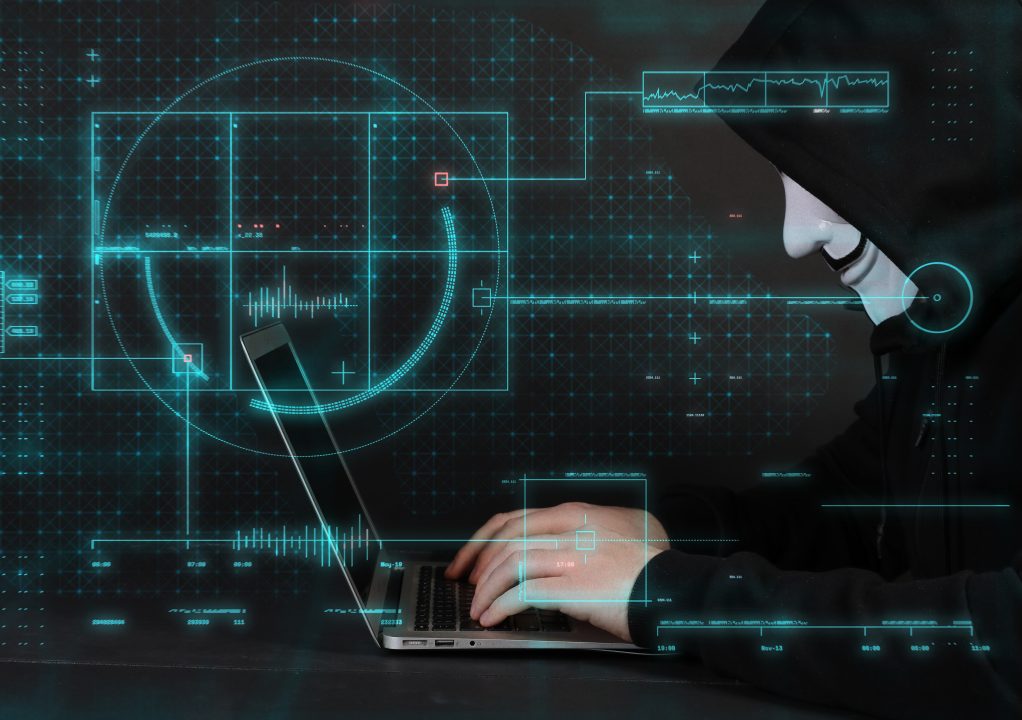 Anonymous computer hacker over abstract digital background. PUBLIC DOMAIN