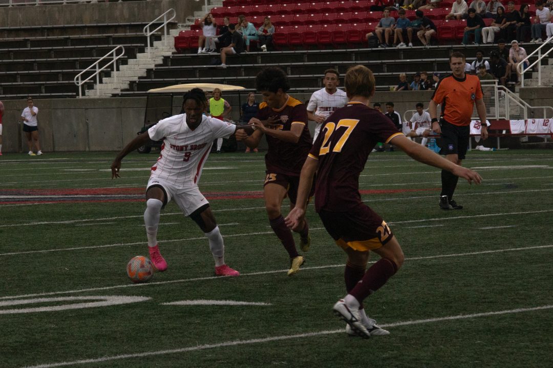 Forward Olsen Aluc fights for the ball against Iona on Monday, Aug. 28. Aluc scored the first goal of his Stony Brook career in the loss on Monday night. TIM GIORLANDO/THE STATESMAN