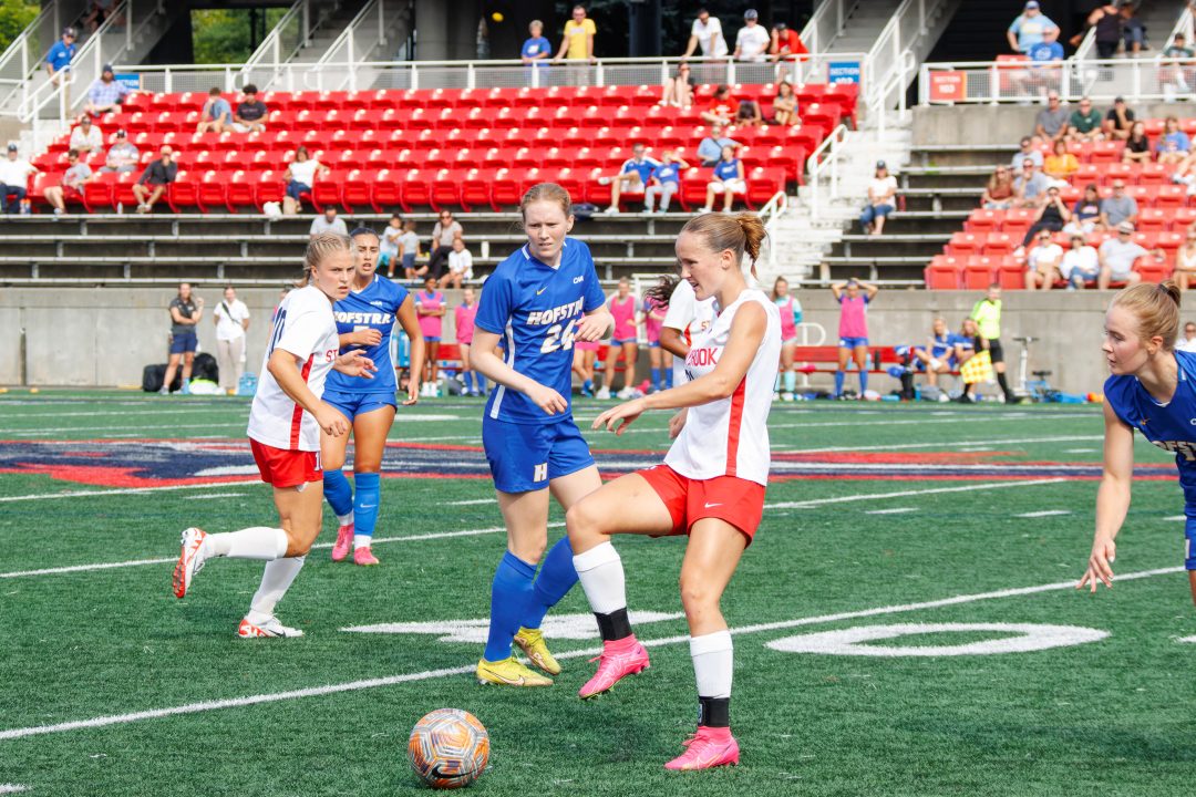 Forward Gabrielle Côté passes the ball behind her while midfielder Linn Beck looks on against Hofstra on Sunday, Sept. 17. The two players will look to lead the Stony Brook womens soccer teams offense to a bounce back against William & Mary. STANLEY ZHENG/THE STATESMAN