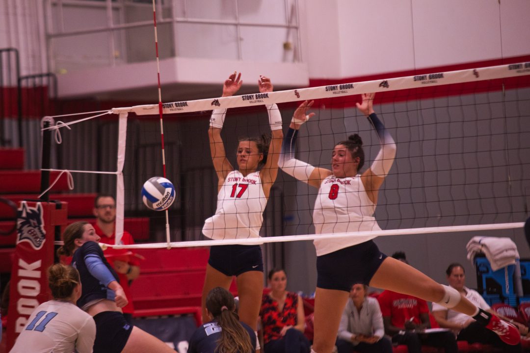 Outside hitter Leoni Kunz (left) and middle blocker Abby Campbell (right) share a block assist against Columbia on Wednesday, Sept. 6. Kunz led the Stony Brook women’s volleyball team with seven total blocks against the Lions. TIM GIORLANDO/THE STATESMAN