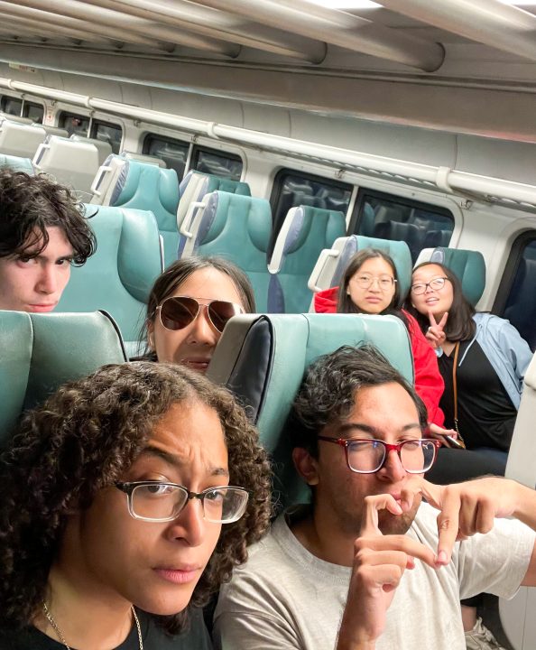 A picture of me and my friends taking the train from Port Jefferson to Stony Brook on Aug. 24, 2023. On the left front side are Rafael Santos and Xingling Yu (myself). On the left back side are Jeslyn Valdez and Kazi Hamza Rashed. On the right side are Amanda Lin and SoRee Chon. 