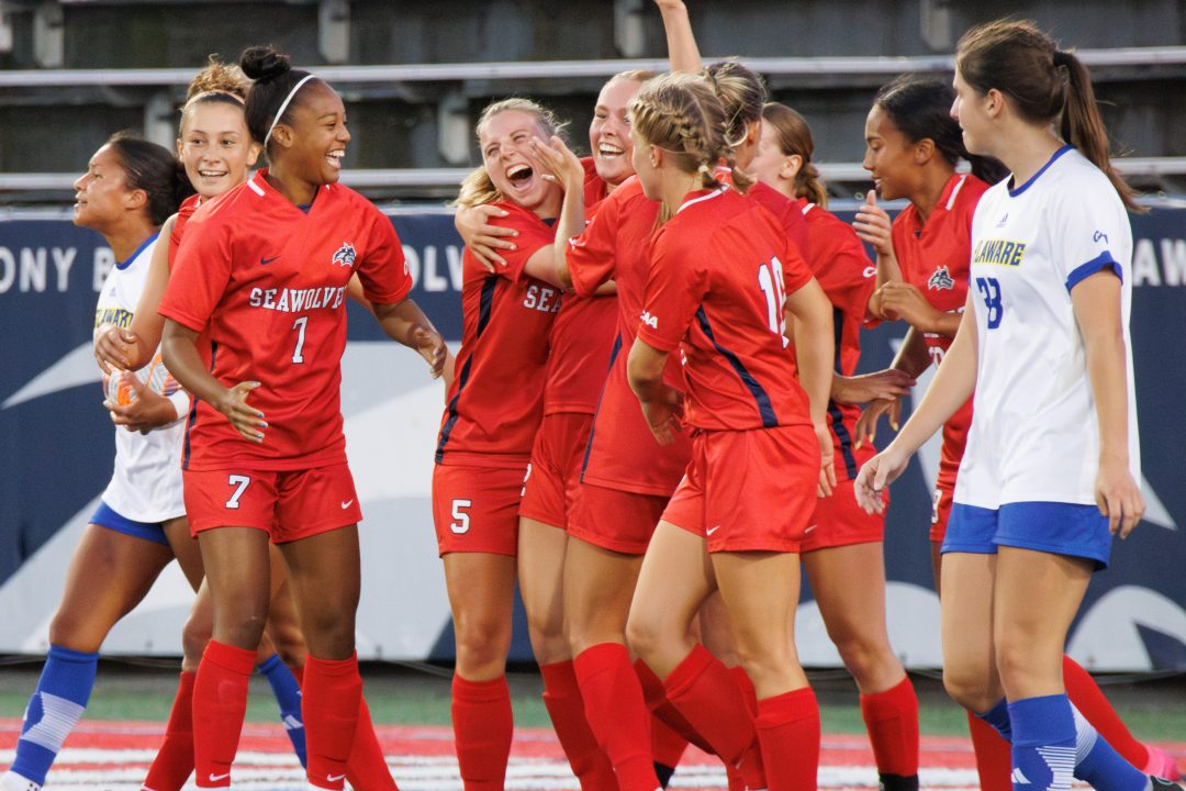 The Stony Brook womens soccer team celebrates a goal versus Delaware on Sept. 14. The Blue Hens helped the Seawolves clinch a playoff berth on Sunday in a scoreless draw versus the University of North Carolina Wilmington. STANLEY ZHENG/THE STATESMAN