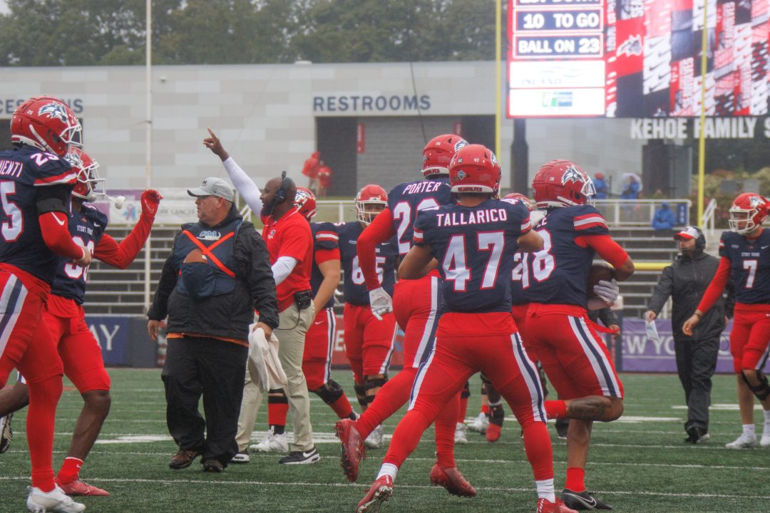 Several Stony Brook football players celebrate an interception by free safety Jalen Hoyle (18) against Richmond on Saturday, Sept. 23. The Seawolves next game against Morgan State University has been canceled due to a mass shooting from Tuesday, Oct. 2. STANLEY ZHENG/THE STATESMAN