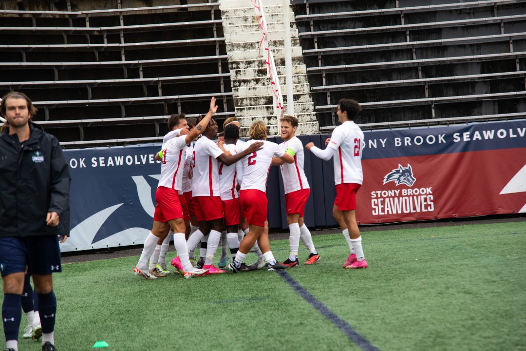 The Stony Brook mens soccer team celebrates a goal by forward Caleb Danquah against the University of North Carolina Wilmington on Saturday, Sept. 30. The Seawolves will take their top-tier offense to Charleston for a showdown on Saturday. MACKENZIE YADDAW/THE STATESMAN