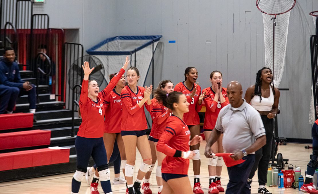 Several Stony Brook womens volleyball players celebrate a point against Delaware from the bench on Saturday, Oct. 14. The Seawolves have a must-win series this weekend versus William & Mary. BRITTNEY DIETZ/THE STATESMAN