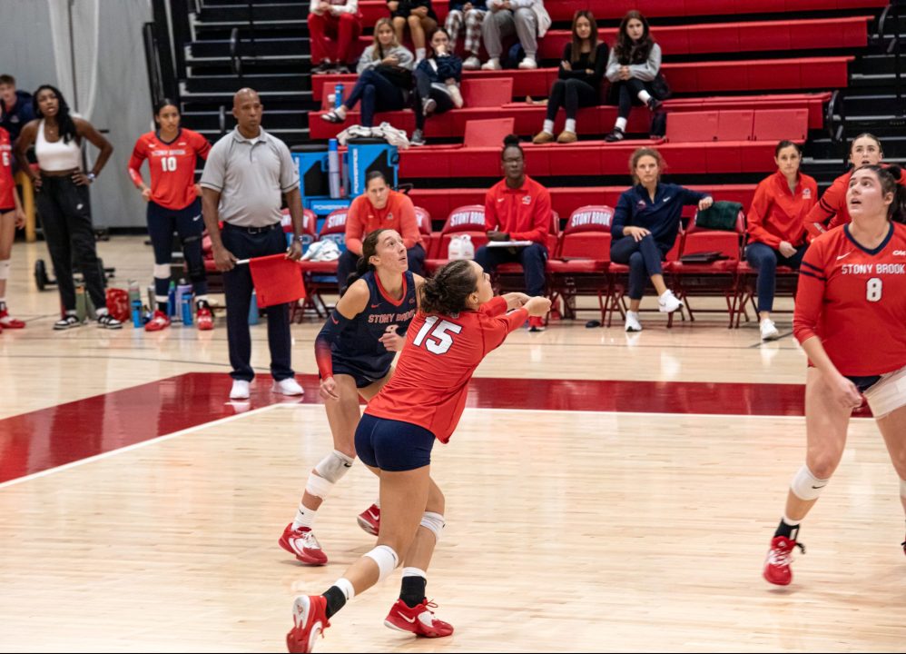 Outside hitter Kali Moore 15) bumps the ball into the air while libero Julia Patsos 9) and middle blocker Abby Campbell 8) get into position. Moore led the Stony Brook womens volleyball team in scoring this weekend at Towson. BRITTNEY DIETZ/THE STATESMAN