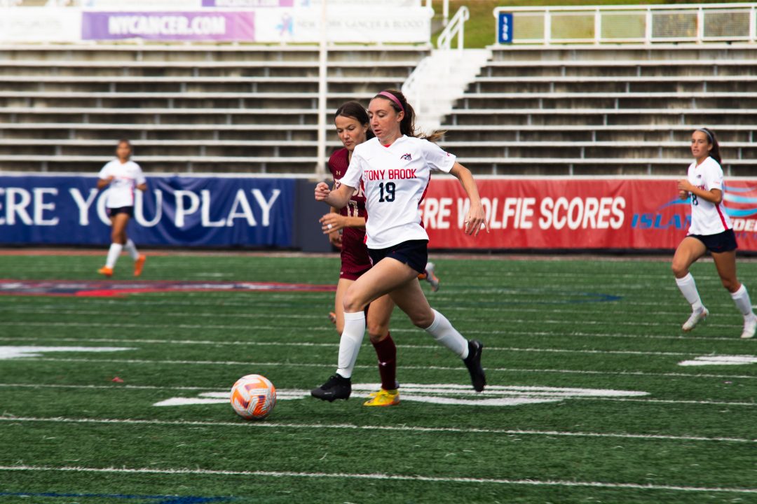 Midfielder Ashley Bell outruns an Elon defender on Sunday, Oct. 15. Bell scored her second goal of the week in the win against the Phoenix. TIM GIORLANDO/THE STATESMAN