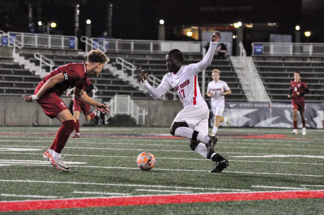 Forward Caleb Danquah crosses up a Temple defender on Tuesday, Oct. 17. The Stony Brook mens soccer team was shut out on Friday by Monmouth. GEORGE CARATZAS/THE STATESMAN