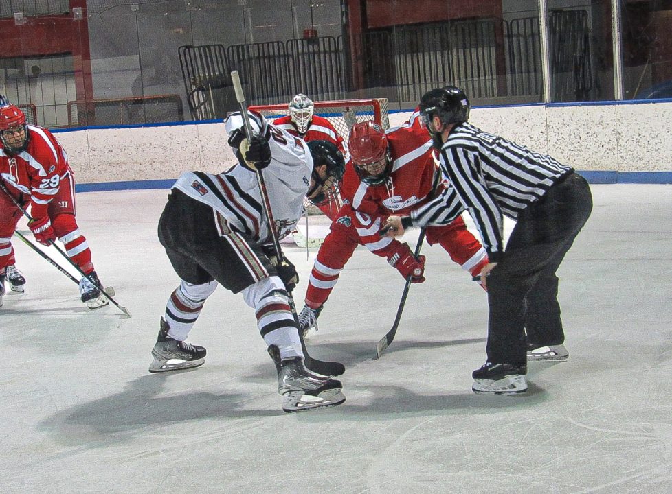 Center James Kozicki (center) lines up to take a faceoff against Manhattanville on Saturday, Oct. 21. The Stony Brook hockey team was defeated in its exhibition matchup at Manhattanville. ANGELINA LIVIGNI/THE STATESMAN