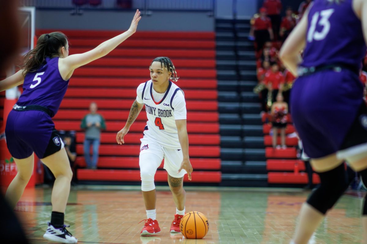 Shooting guard Victoria Keenan dribbles the ball against Holy Cross on Sunday, Nov. 19. Keenan led the Stony Brook womens basketball team with 16 points on Sunday at Minnesota. STANLEY ZHENG/THE STATESMAN