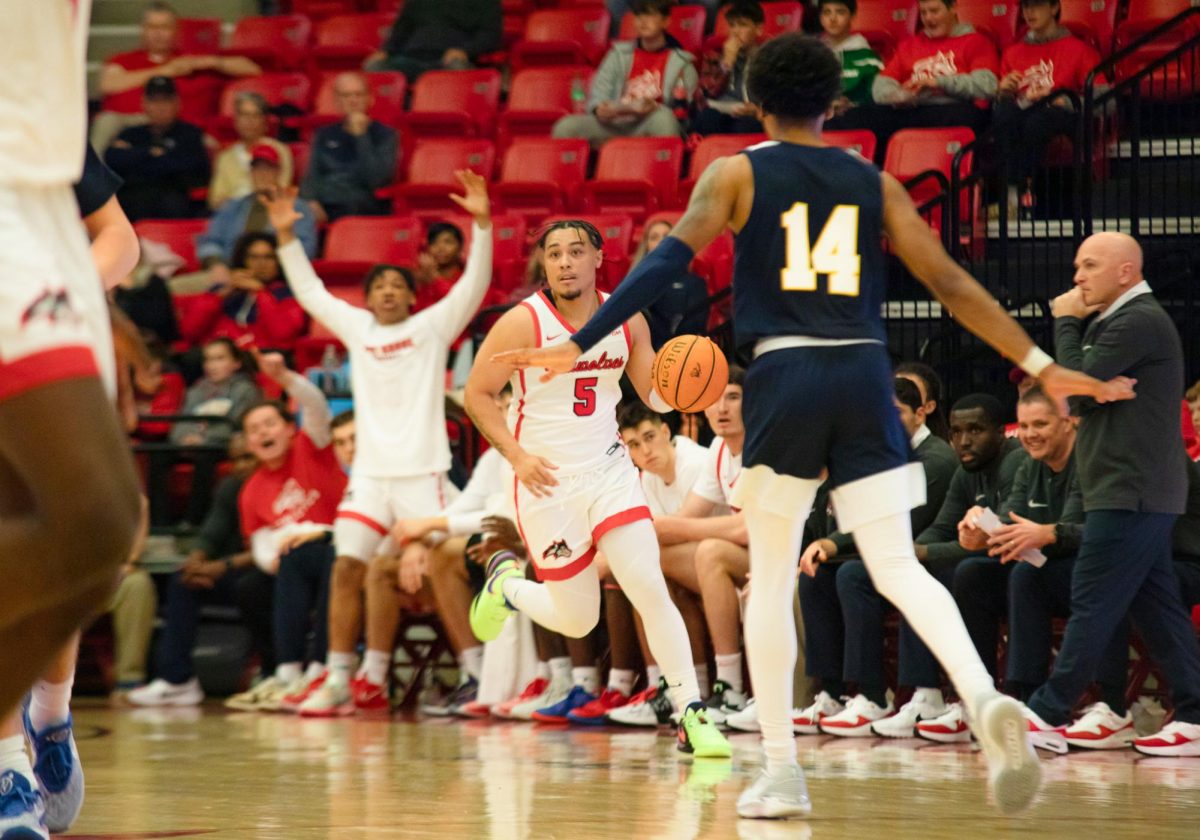 Point guard Aaron Clarke (5) brings the ball up the court against St. Josephs University on Friday, Nov. 10. Clarke had the best game of his Stony Brook career on Monday at Duquesne. BRITTNEY DIETZ/THE STATESMAN
