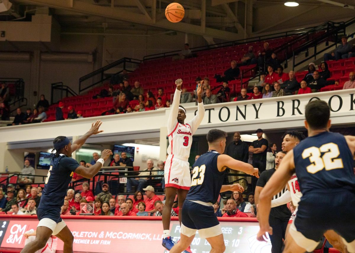 Shooting guard Toby Onyekonwu takes a three-point field goal against St. Josephs on Friday, Nov. 10. Onyekonwu scored a career-high 16 points in the victory on Friday. BRITTNEY DIETZ/THE STATESMAN