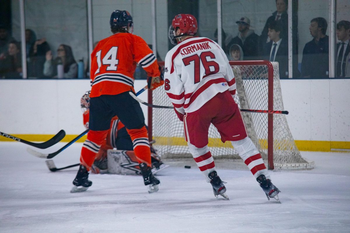 Center Will Kormanik watches fellow center Matteo Daita score a goal against Syracuse on Saturday, Nov. 11. Kormanik assisted this goal and tallied five total points over the weekend. ANGELINA LIVIGNI/THE STATESMAN