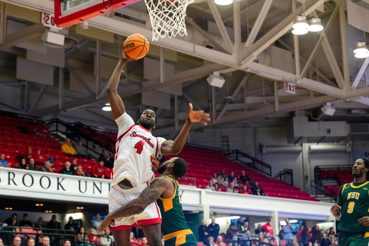 Center Chris Maidoh throws down a slam dunk against Norfolk State on Wednesday, Dec. 13. Maidoh posted career highs in both points and rebounds in the victory. BRITTNEY DIETZ/THE STATESMAN