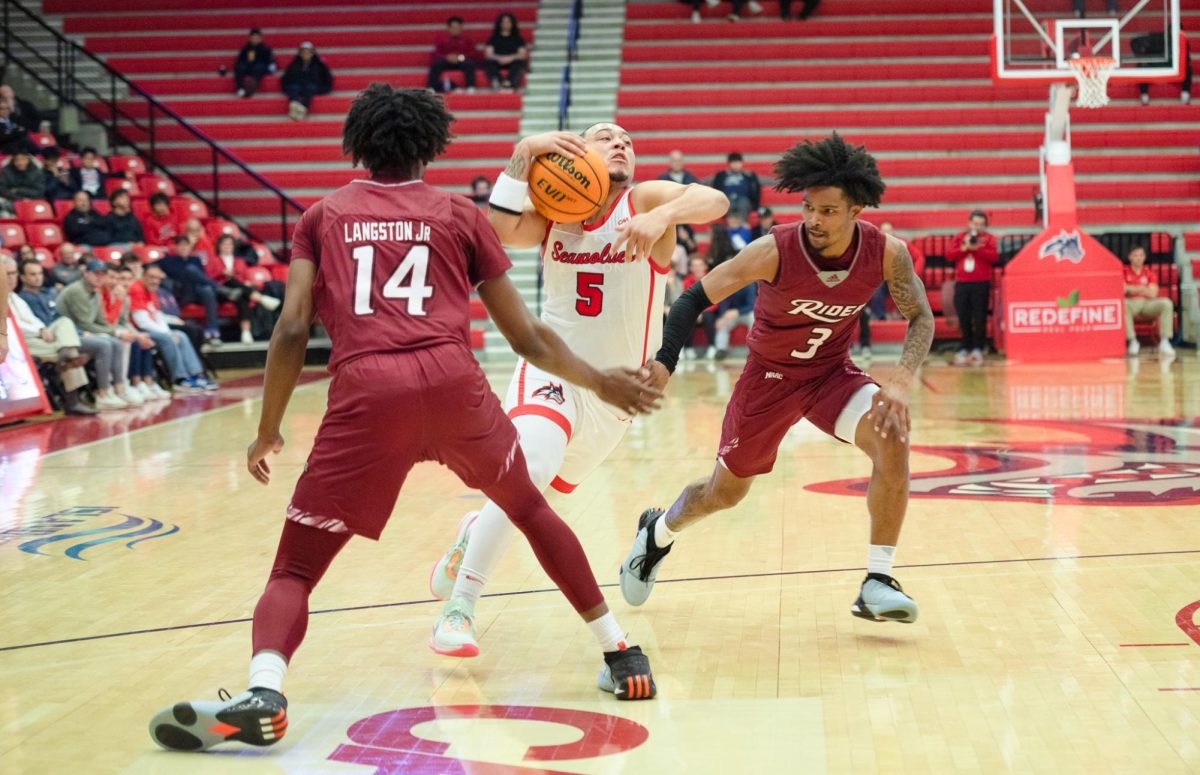 Point guard Aaron Clarke drives the lane against Rider on Nov. 20. Clarke led the Stony Brook mens basketball in scoring for the second time in three games, leading it to a win over Brown. ANGELINA LIVIGNI/THE STATESMAN