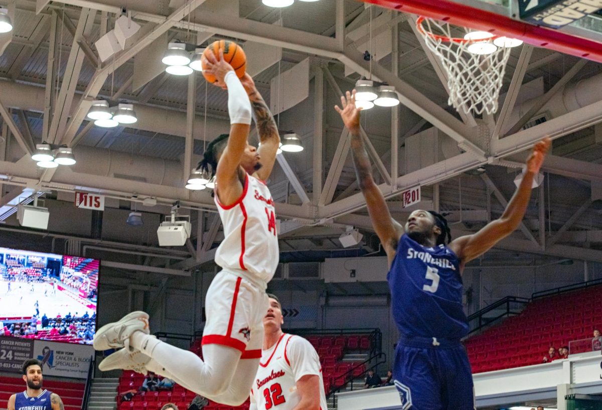 Small forward Tyler Stephenson-Moore leaps up for a dunk against Stonehill on Wednesday, Dec. 6. Stephenson-Moore led the Stony Brook mens basketball team with 23 points in the win. BRITTNEY DIETZ/THE STATESMAN
