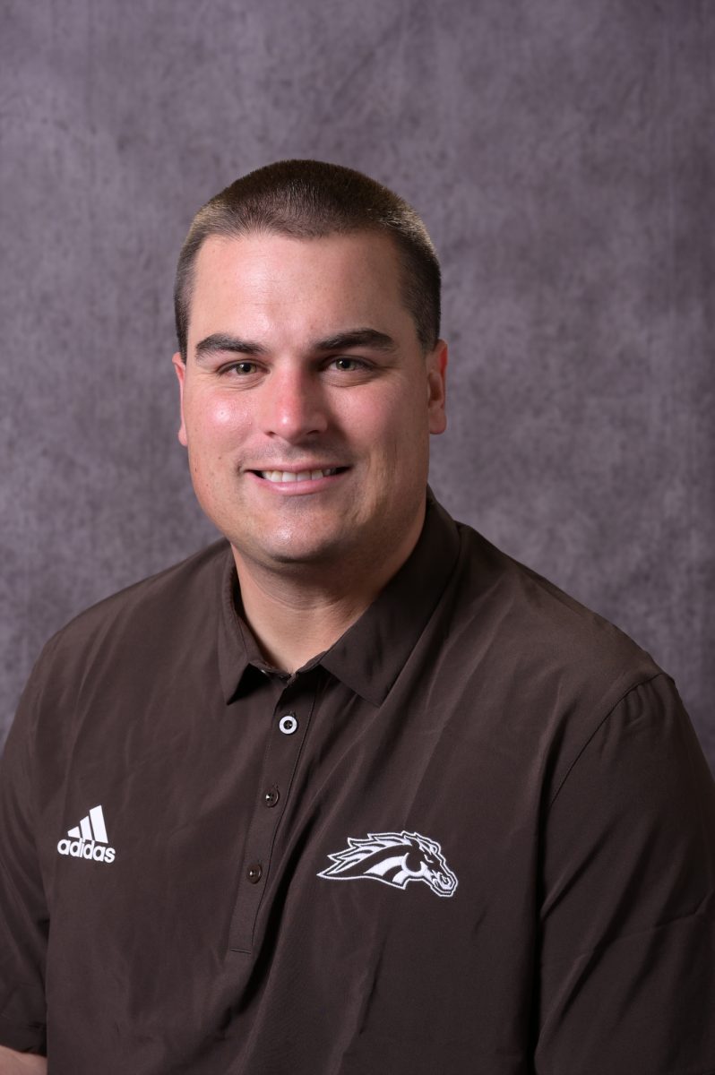 Former Western Michigan Football offensive coordinator Billy Cosh poses for his headshot. Cosh was hired by Stony Brook University as the schools next head football coach. PHOTO COURTESY OF WESTERN MICHIGAN ATHLETICS