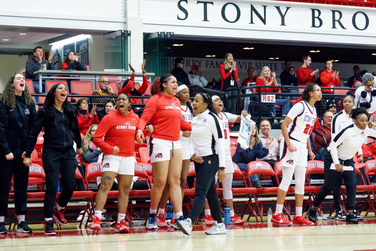 Head coach Ashley Langford (center) and the Stony Brook womens basketball teams bench celebrate a play against Charleston on Friday, Jan. 19. Langfords team will host Drexel on Sunday. ANGELINA LIVIGNI/THE STATESMAN