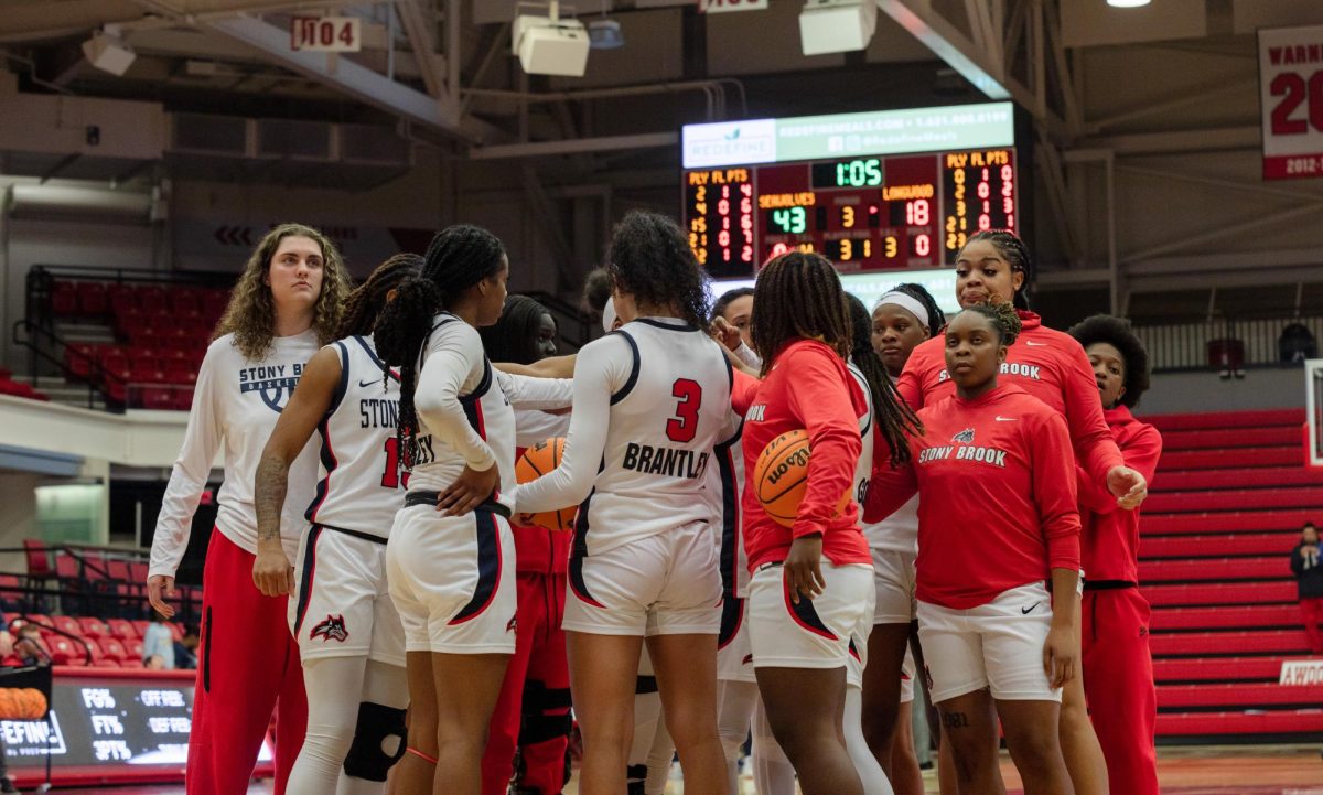 The Stony Brook women’s basketball team huddled around before a game against Longwood on Dec. 11. The Seawolves will open their conference season tomorrow. BRITTNEY DIETZ/THE STATESMAN