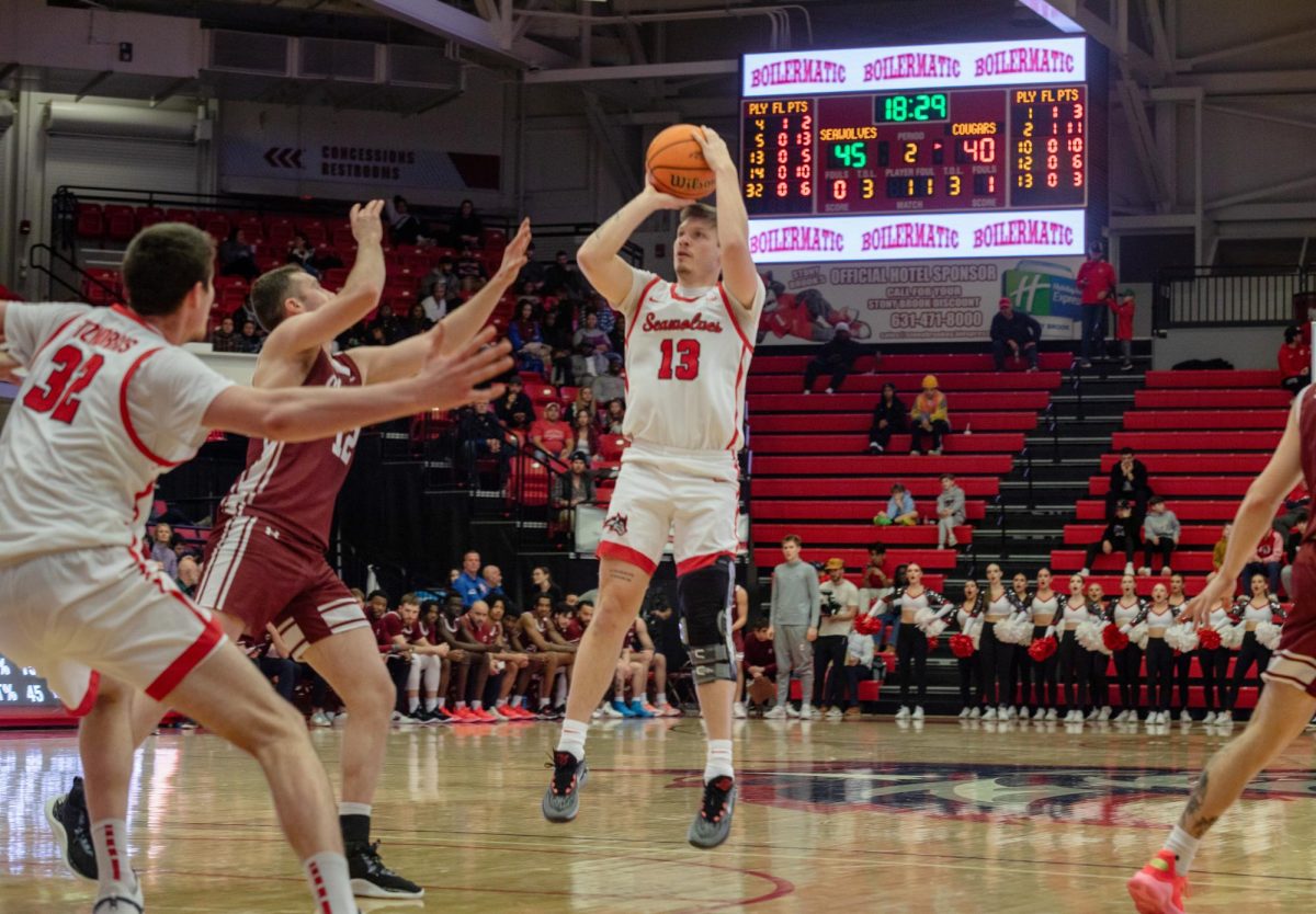 Point guard Dean Noll takes a jump shot from the top of the key against Charleston on Saturday, Jan. 6. Noll led the Stony Brook mens basketball team in scoring on Thursday night at Towson. ANGELINA LIVIGNI/THE STATESMAN