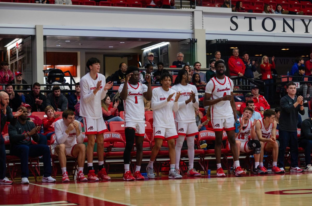 The Stony Brook mens basketball teams bench celebrates against Charleston on Saturday, Jan. 6. The Seawolves will take on the Towson Tigers on Thursday night. ANGELINA LIVIGNI/THE STATESMAN