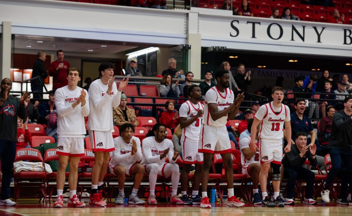 The Stony Brook mens basketball teams bench celebrates a shot against Charleston on Saturday, Jan. 6. The Seawolves will take on William & Mary on Saturday afternoon. ANGELINA LIVIGNI/THE STATESMAN