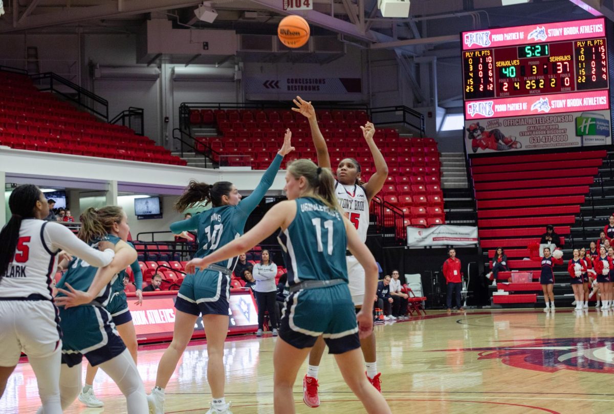 Power forward Shamarla King shoots a jump shot from the top of the key against the University of North Carolina Wilmington on Sunday, Jan. 7. King hit this shot, sparking a streak of 12 unanswered points. ANGELINA LIVIGNI/THE STATESMAN