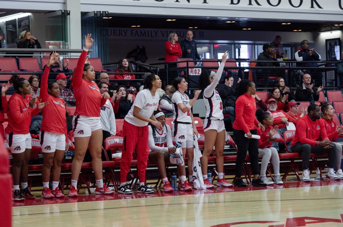 The Stony Brook womens basketball teams bench celebrates a three-pointer against the University of North Carolina Wilmington on Sunday, Jan. 7. The Seawolves will take on Delaware on the road on Sunday. ANGELINA LIVIGNI/THE STATESMAN