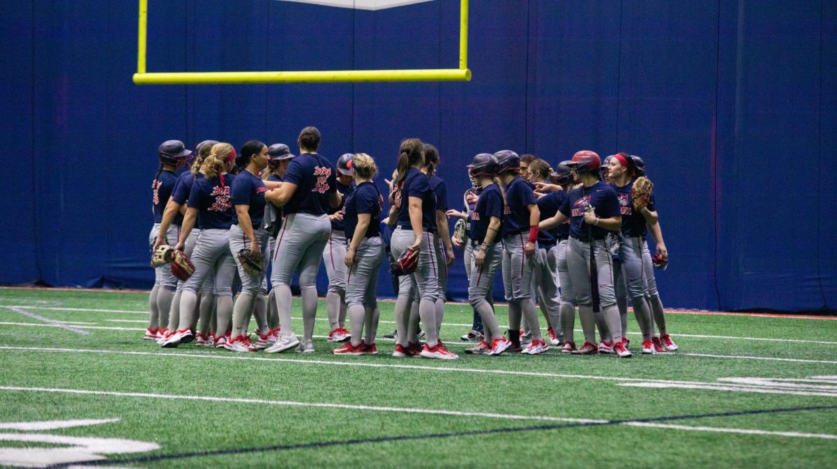 The Stony Brook softball team huddles at the end of practice on Wednesday, Jan. 24. The Seawolves are entering the 2024 season with championship expectations. BRITTNEY DIETZ/THE STATESMAN