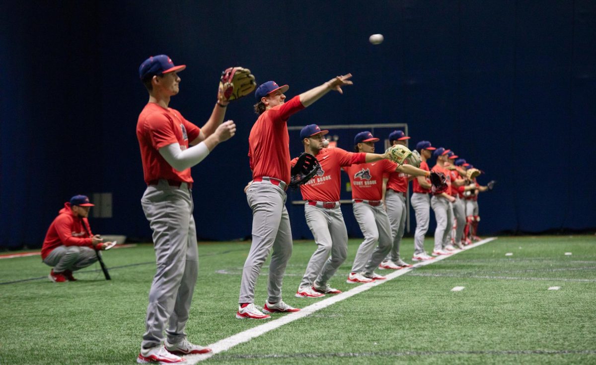 The Stony Brook baseball team warms up at the start of practice on Wednesday, Jan. 24. The Seawolves are looking to bounce back in the 2024 season. BRITTNEY DIETZ/THE STATESMAN