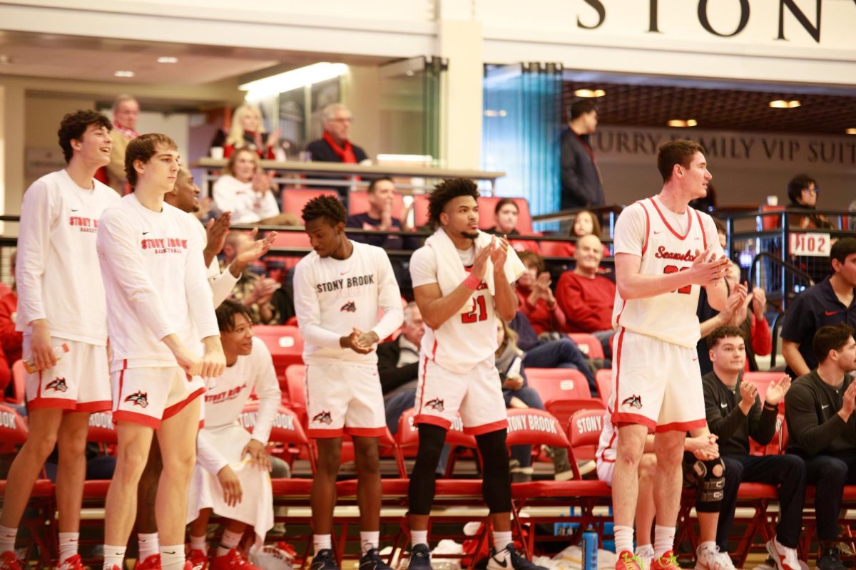 Several Stony Brook mens basketball players cheer on their teammates from the bench against William & Mary on Saturday, Feb. 24. The Seawolves will play Drexel tomorrow night. ANGELINA LIVIGNI/THE STATESMAN