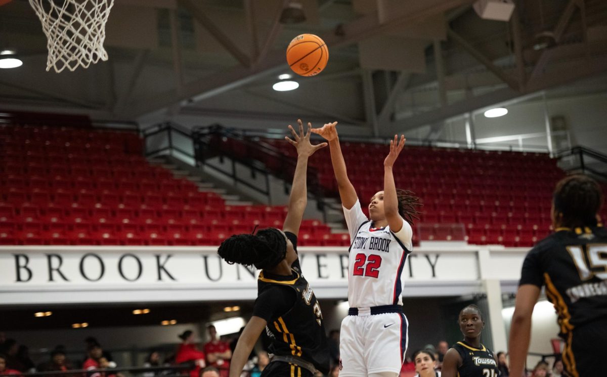 Power forward Sherese Pittman takes a jump shot from the post over a Towson defender on Friday, Feb. 9. Pittman totaled 17 points and six rebounds in the Stony Brook womens basketball teams loss. MACKENZIE YADDAW/THE STATESMAN