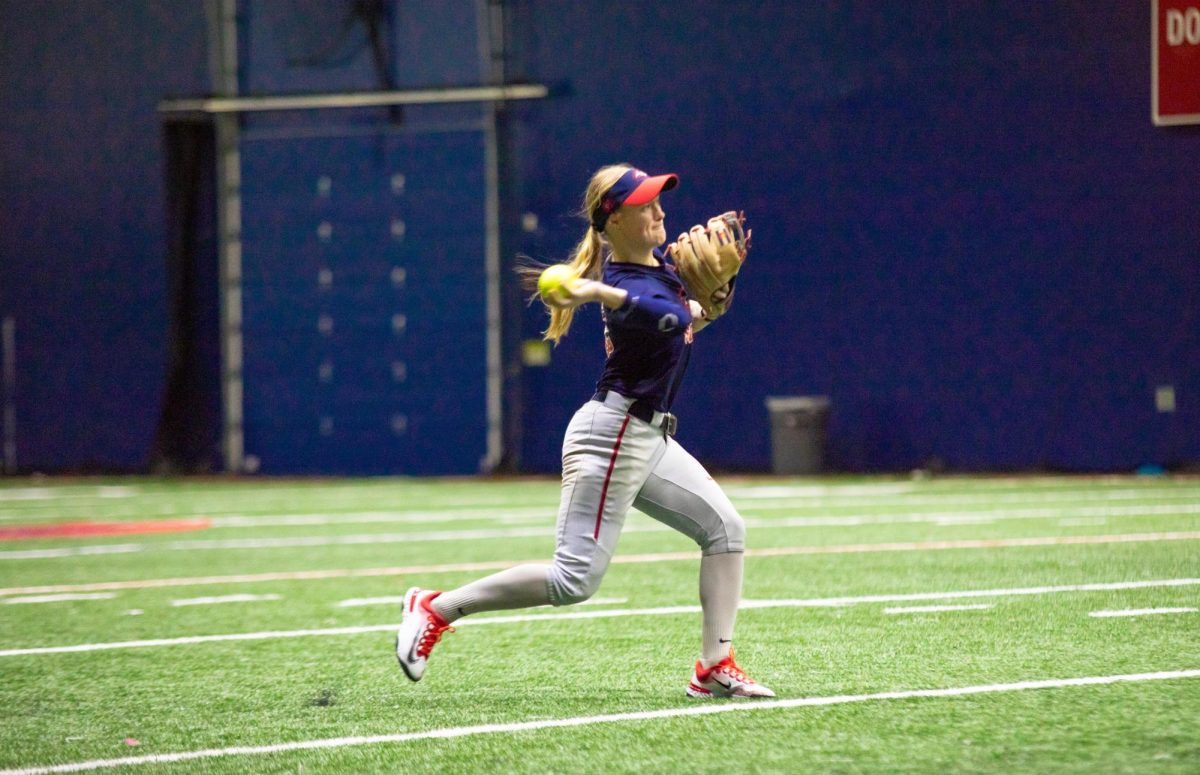 Shortstop Kyra McFarland throws to first base during a practice on Jan. 24. McFarland led the Stony Brook softball team with four hits this past weekend. BRITTNEY DIETZ/THE STATESMAN