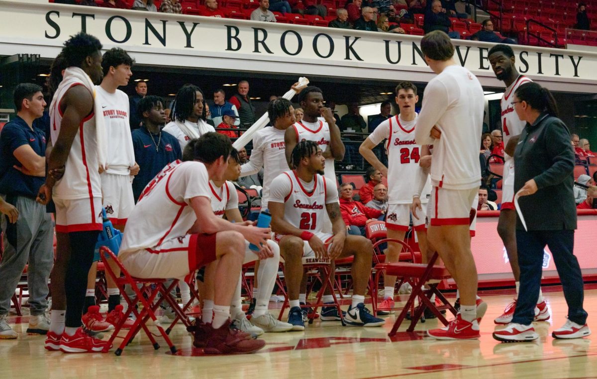 The Stony Brook mens basketball team takes a break during a timeout against Monmouth on Jan. 25. The Seawolves will take on the Campbell Camels tomorrow in North Carolina. IRENE YIMMONGKOL/THE STATESMAN