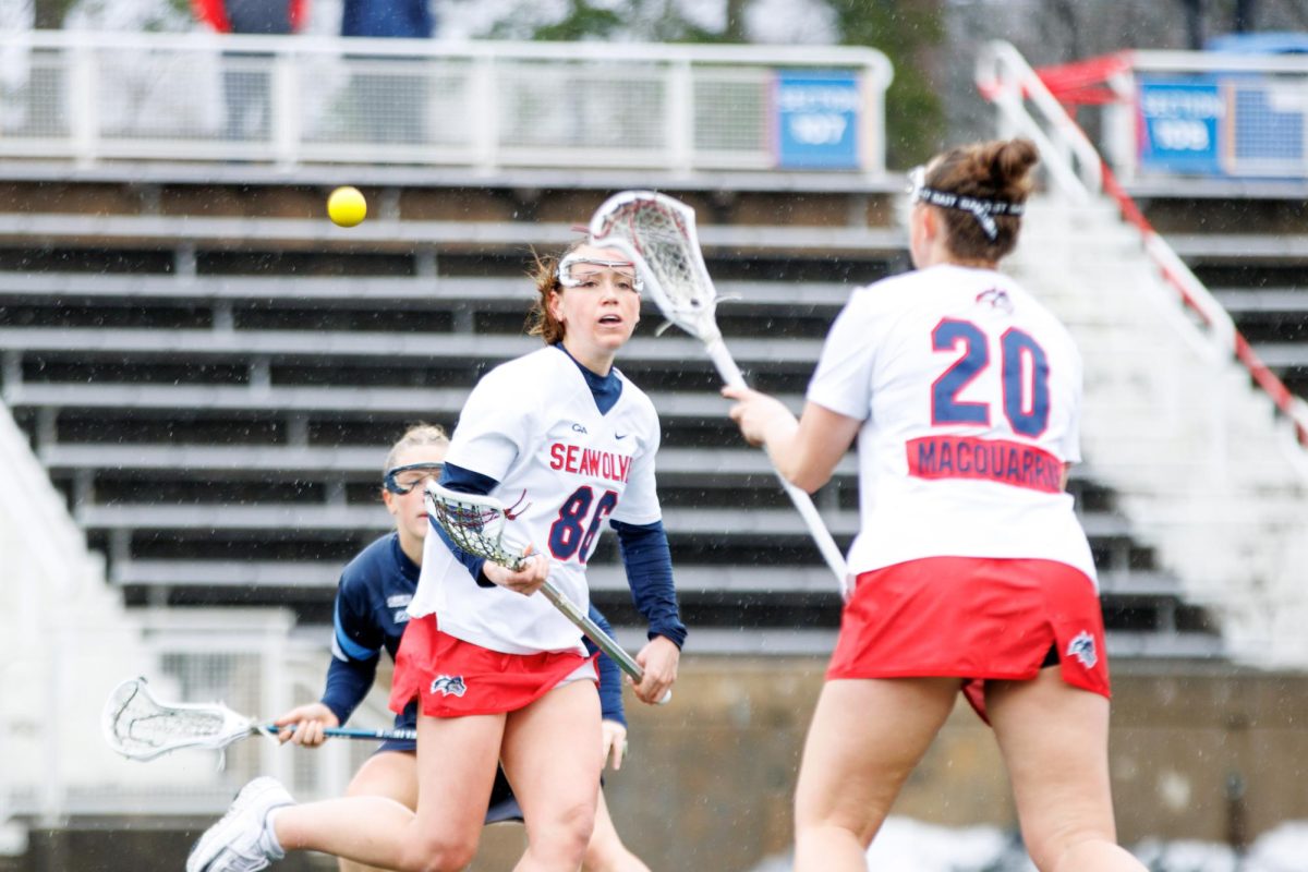 Midfielder Charlotte Verhulst (background) passes the ball to fellow midfielder Erin MacQuarrie (foreground) against Villanova on Saturday, March 2. Verhulst scored three goals on Monday while MacQuarrie scored one and had one assist. STANLEY ZHENG/THE STATESMAN
