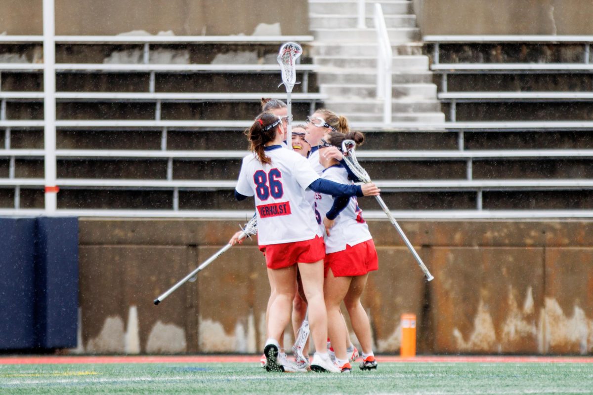 Several Stony Brook womens lacrosse players celebrate a goal against Villanova on Saturday, March 2. The Seawolves will open their conference season at Towson tomorrow. STANLEY ZHENG/THE STATESMAN