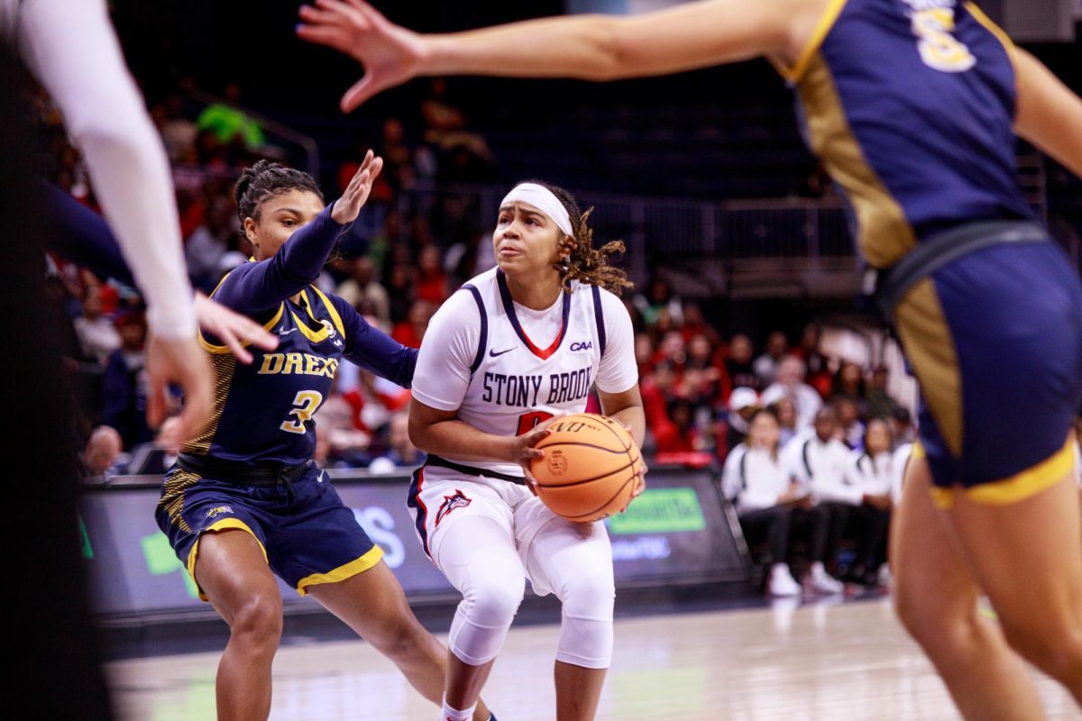 Point guard Gigi Gonzalez prepares to take a jump shot in the paint against Drexel on Sunday, March 17. Gonzalez led the Stony Brook womens basketball team with 13 points and five assists in the loss to Illinois. ANGELINA LIVIGNI/THE STATESMAN