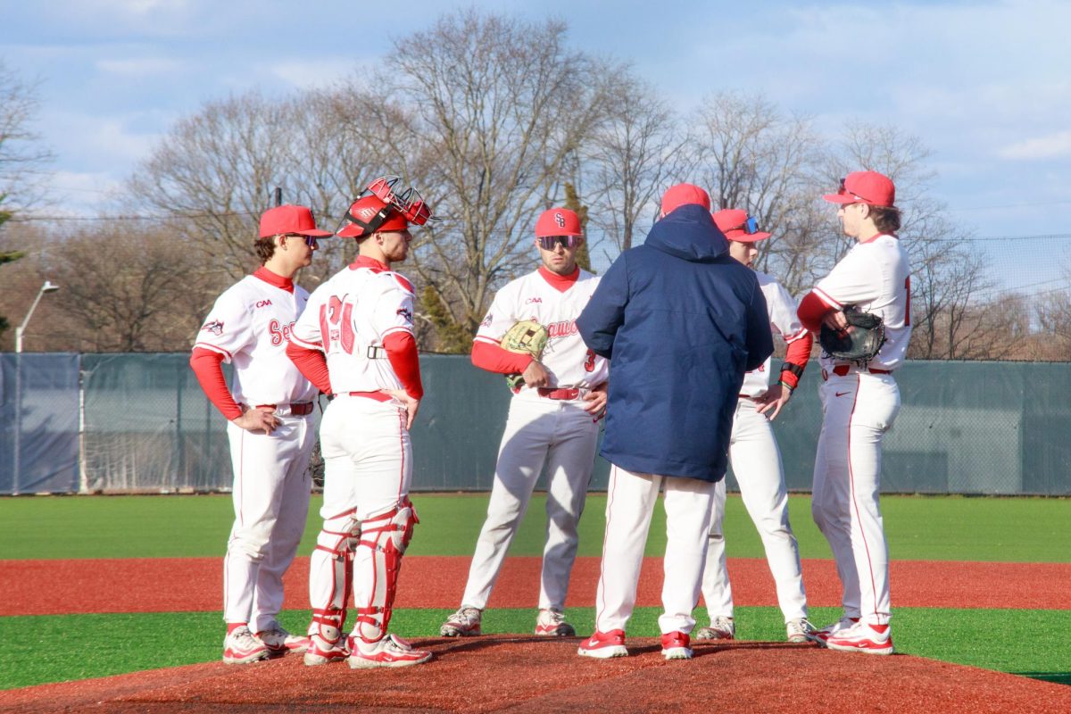 The Stony Brook baseball teams infield gathers around head coach Matt Senk (center) during a pitching change on Tuesday, March 19. The Seawolves will open conference play up this Friday at William & Mary. IRENE YIMMONGKOL/THE STATESMAN