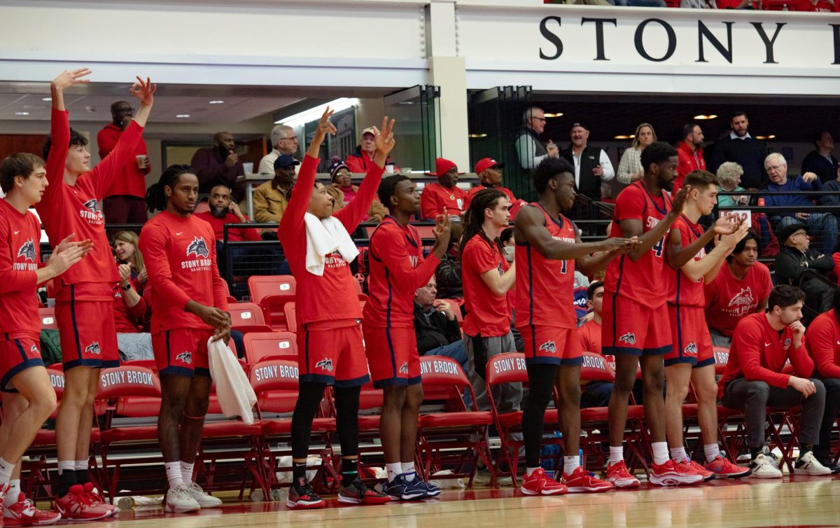 The Stony Brook mens basketball teams bench celebrates a play against Hofstra on Jan. 22. The Seawolves will battle with the Pride in the semifinals tomorrow night. BRITTNEY DIETZ/THE STATESMAN