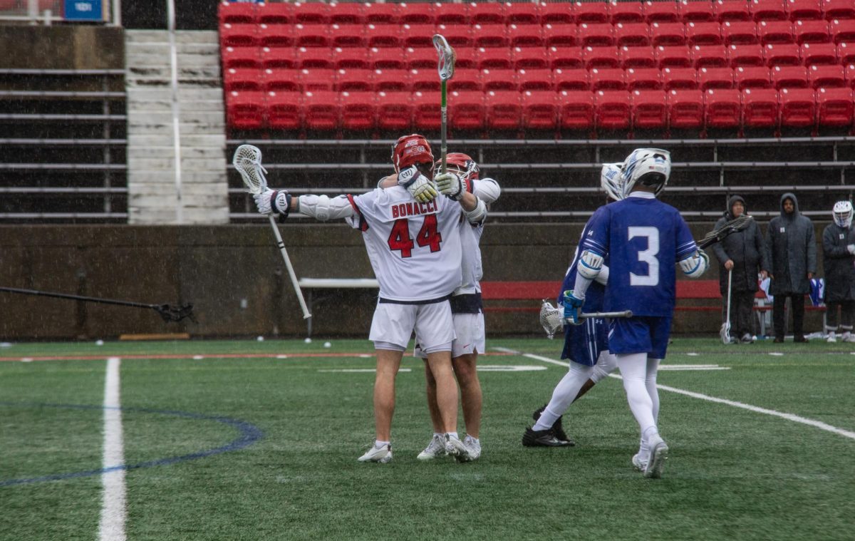 Attackman Justin Bonacci embraces a teammate after a goal against Hampton on March 2. Bonaccis scoring will be needed for the Stony Brook mens lacrosse team to beat Monmouth tomorrow. BRITTNEY DIETZ/THE STATESMAN