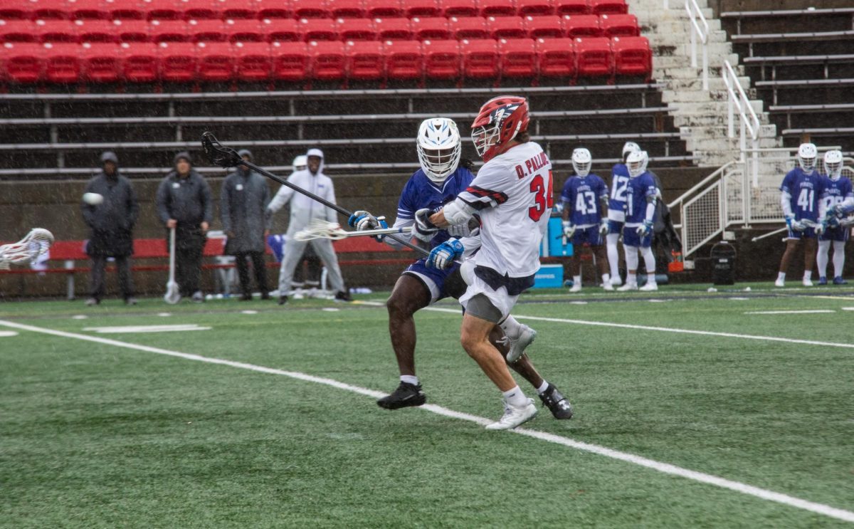 Attackman Dylan Pallonetti takes an off-balanced shot against Hampton on Saturday, March 2. Pallonetti scored five goals in the Stony Brook mens lacrosse teams first home win of the year. BRITTNEY DIETZ/THE STATESMAN