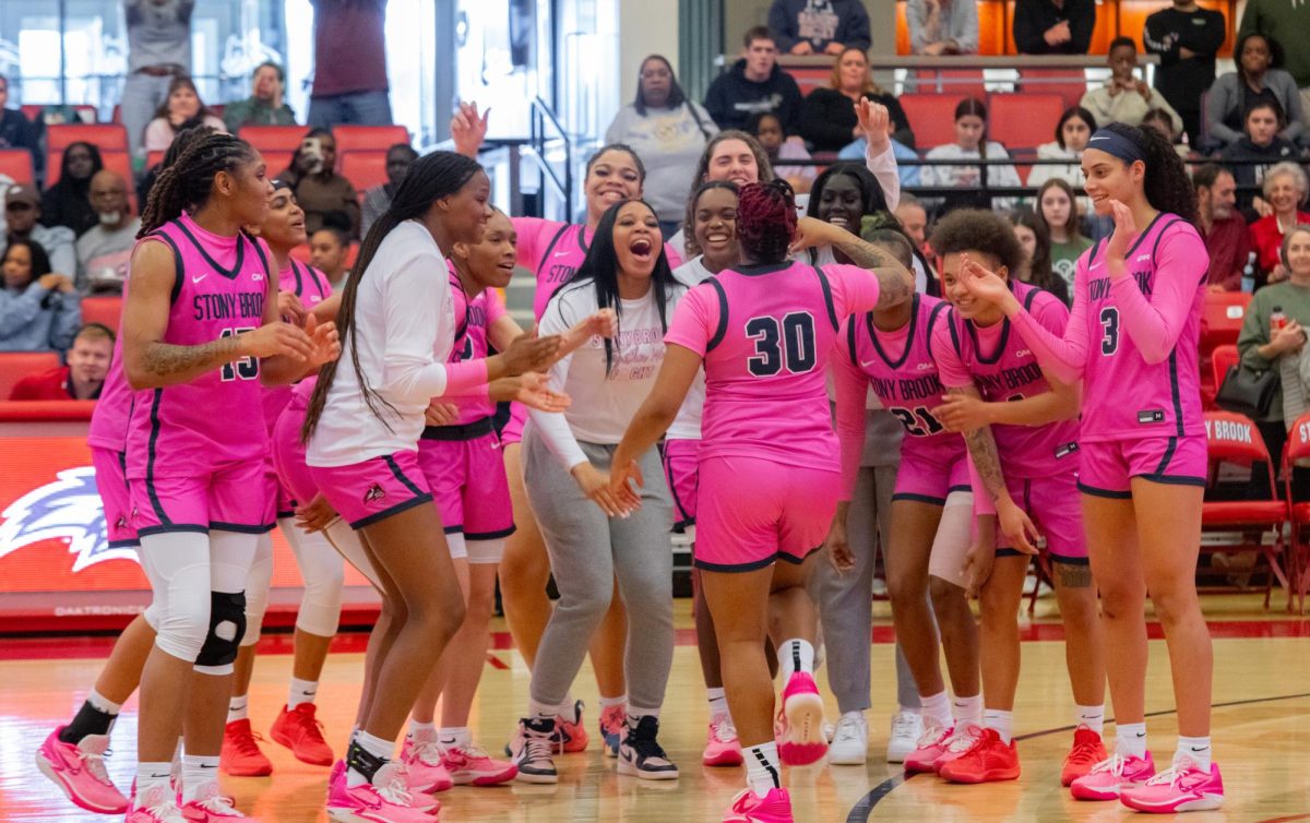 The Stony Brook womens basketball teams players celebrate a win against North Carolina A&T on Sunday, March 3. The Seawolves clinched a share of the regular-season title in this game and will look to secure the outright championship tomorrow. CHRISTOPHER YANG/THE STATESMAN