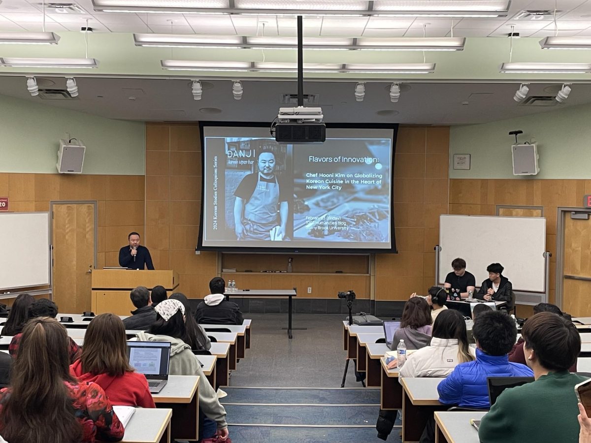 New York City-based chef and restaurateur Hooni Kim speaking to the lecture hall of students about his career experiences and the globalization of Korean cuisines. PHOTO COURTESY OF HEEJEONG SOHN