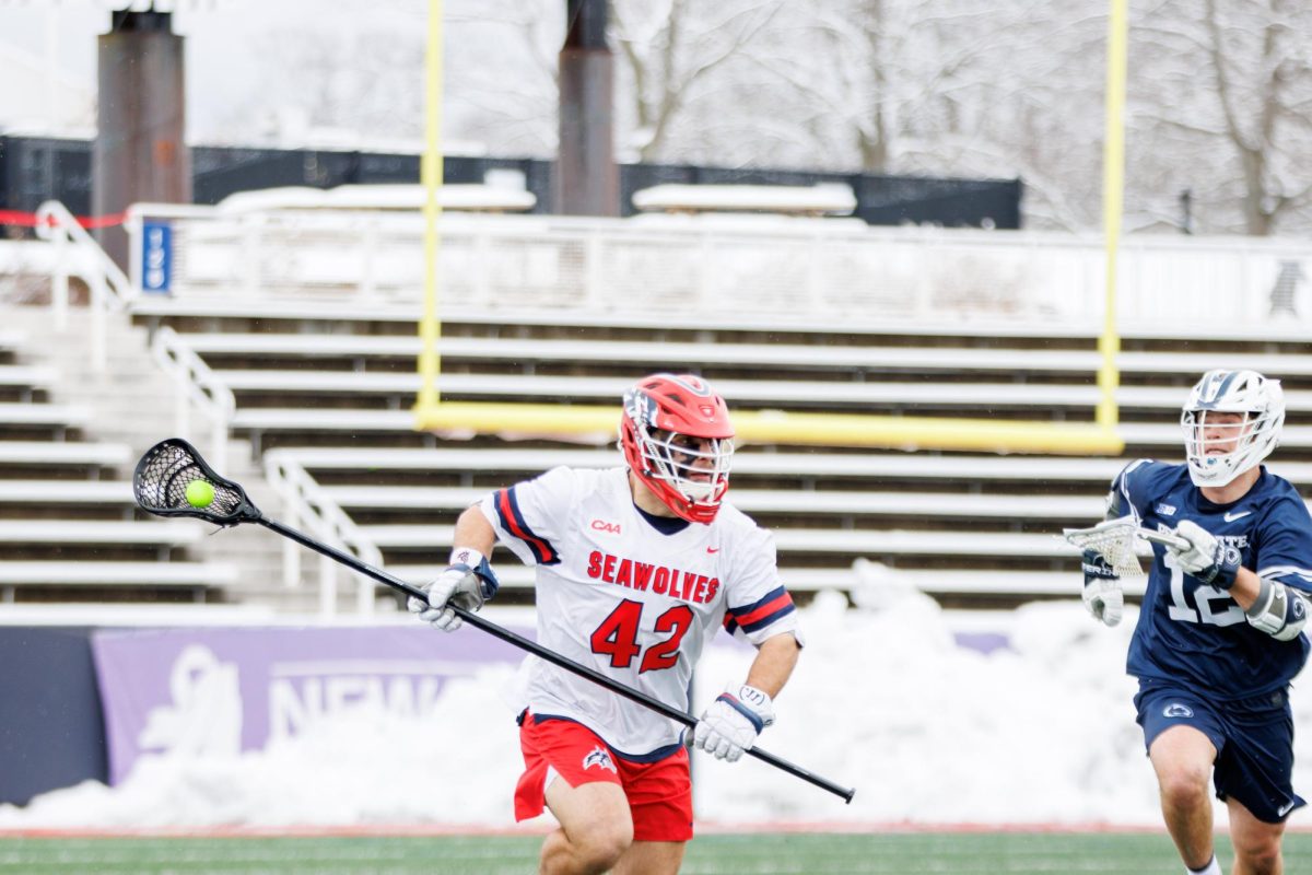 Defender Mikey Sabella advances the ball against Pennsylvania State on Feb 17. Despite Sabellas three caused turnovers, the Stony Brook mens lacrosse team fell to Towson.