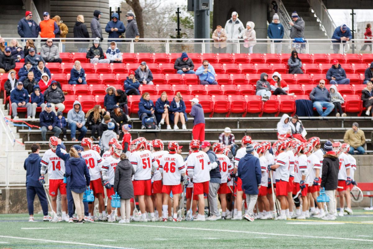 Players from the Stony Brook mens lacrosse team regroup during a timeout against Drexel on Saturday, April 6. The Seawolves need the Dragons to win on Friday to have a shot at clinching a playoff spot against Hofstra on Saturday. STANLEY ZHENG/THE STATESMAN