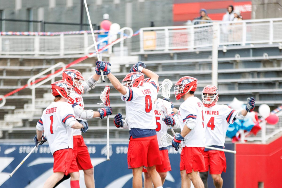Players from the Stony Brook mens lacrosse team celebrate a goal against Drexel on Saturday, April 6. The Seawolves will be playing with their playoff hopes on the line in Connecticut on Saturday against Fairfield. STANLEY ZHENG/THE STATESMAN