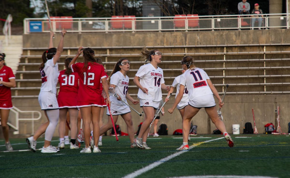 Attacker Kailyn Hart (14) celebrates a goal against Rutgers on Tuesday, April 9. Hart and midfielder Ellie Masera (12) reached 200 goals for their careers in the Stony Brook womens lacrosse teams victory.