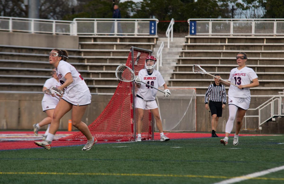 Midfielder Erin MacQuarrie (20) and defender Avery Hines (13) defend the cage alongside goalkeeper Emily Manning (40) on Tuesday, April 9. The Seawolves will be back at home to take on Hofstra on Sunday with a chance to clinch first place in the CAA. BRITTNEY DIETZ/THE STATESMAN